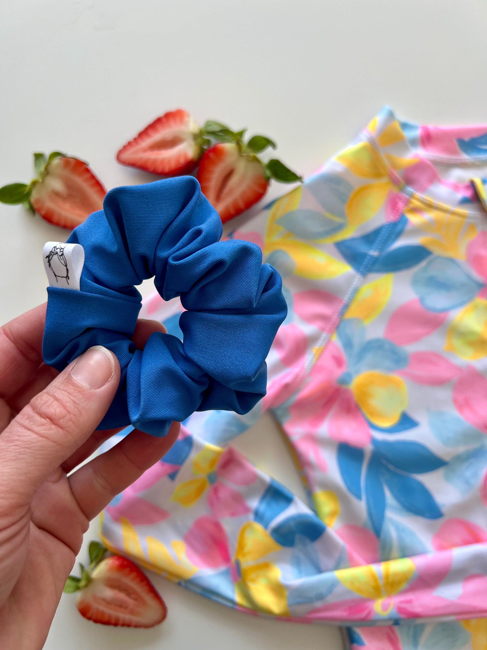 Bright blue hair scrunchie for summer adventures
