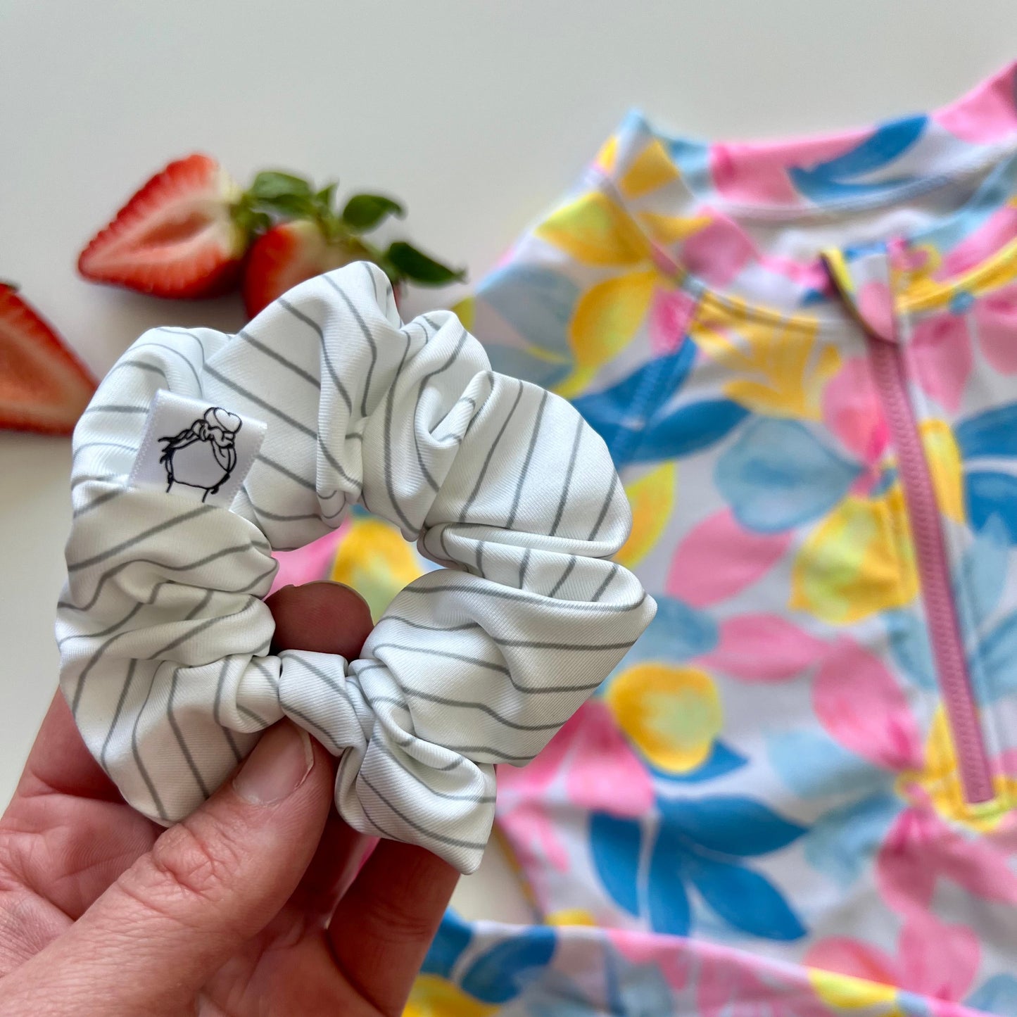 White striped swim scrunchie made from swimsuit fabric