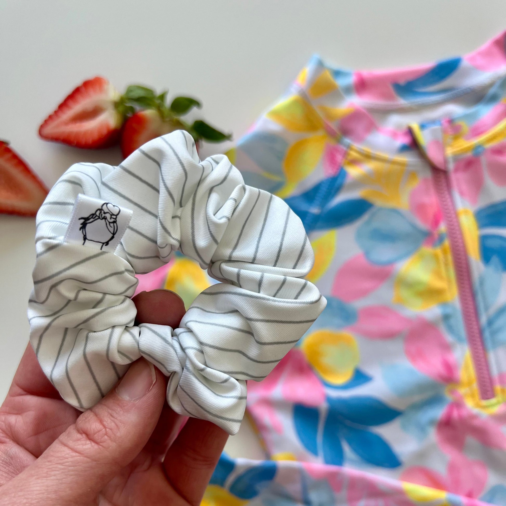 White striped swim scrunchie made from swimsuit fabric