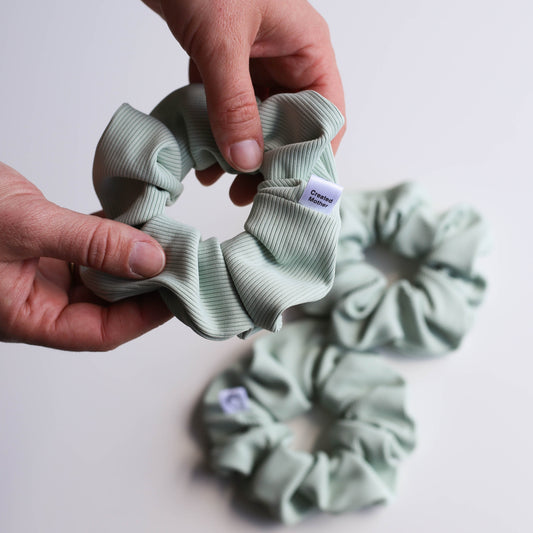 Light sage ribbed swim scrunchie made from quick-dry fabric