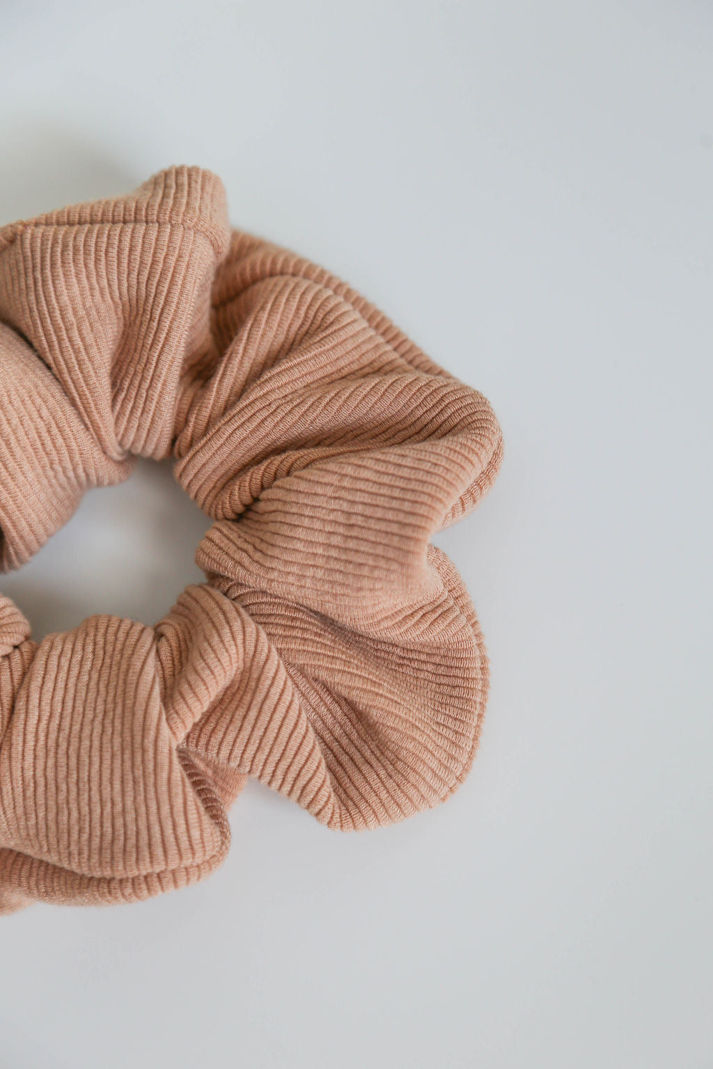 Close-up of the Neutral Thick Ribbed Scrunchie, crafted from heavy-knit fabric for comfort and durability.