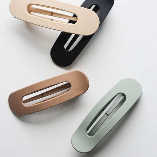 Travel-safe 4-inch flat hair claw clip with minimalist matte finish