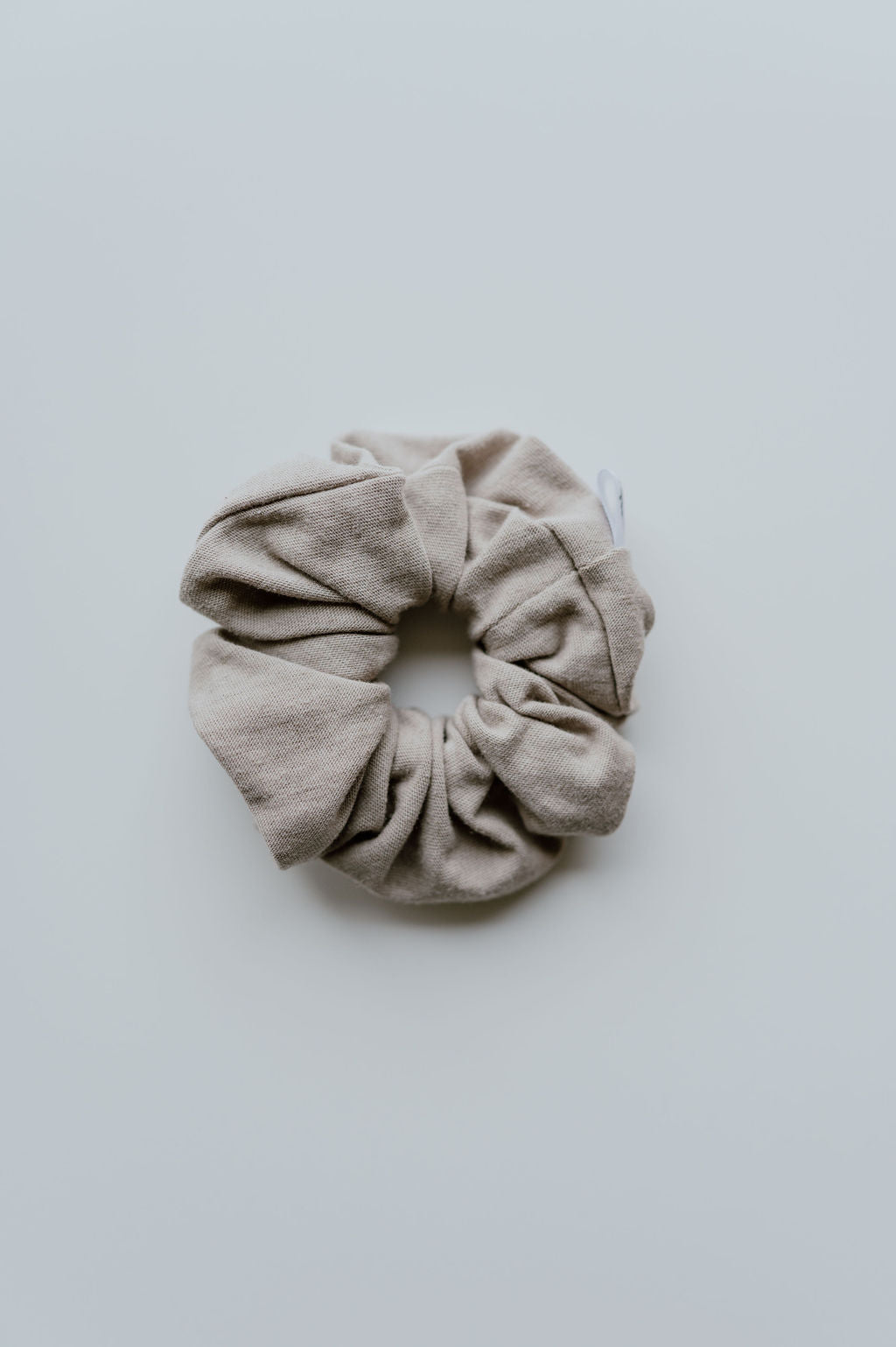 Mini Beige scrunchie on a white background