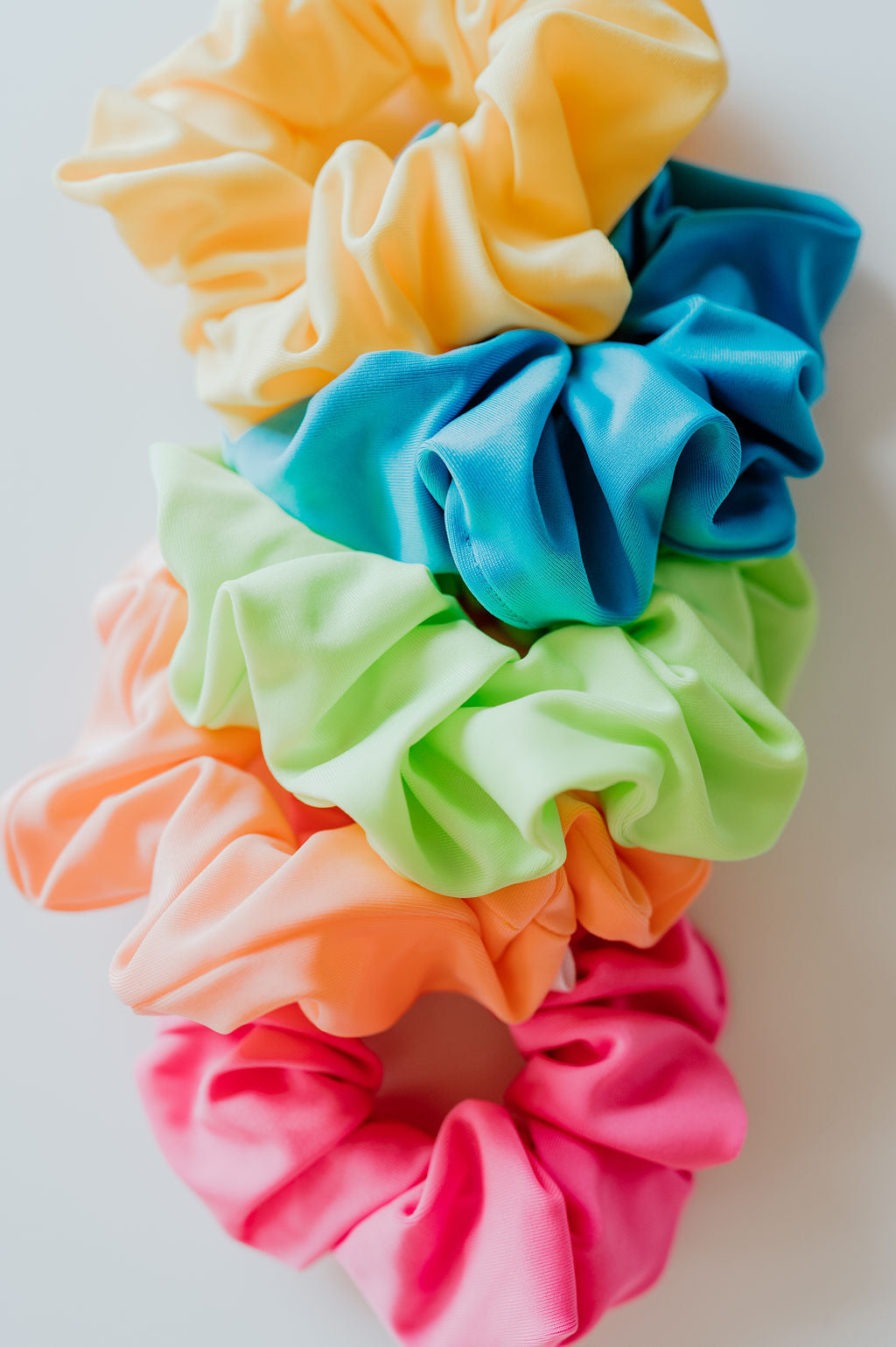 Set of colorful scrunchies on a white background