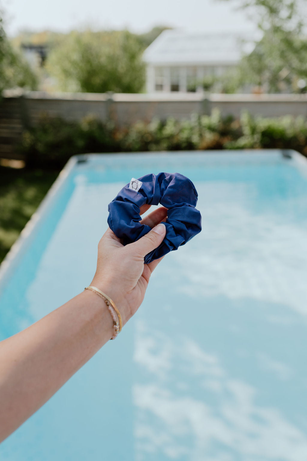 Water-resistant indigo scrunchie for pool and gym use