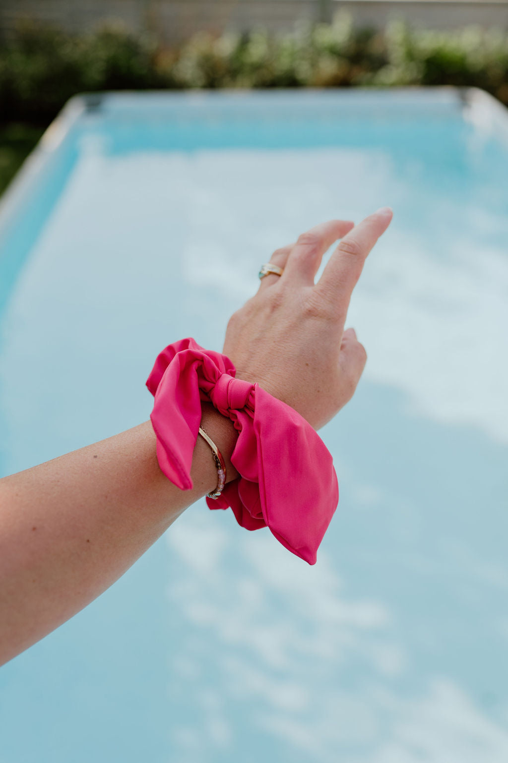 Pink scrunchie ideal for running, hiking, and swimming