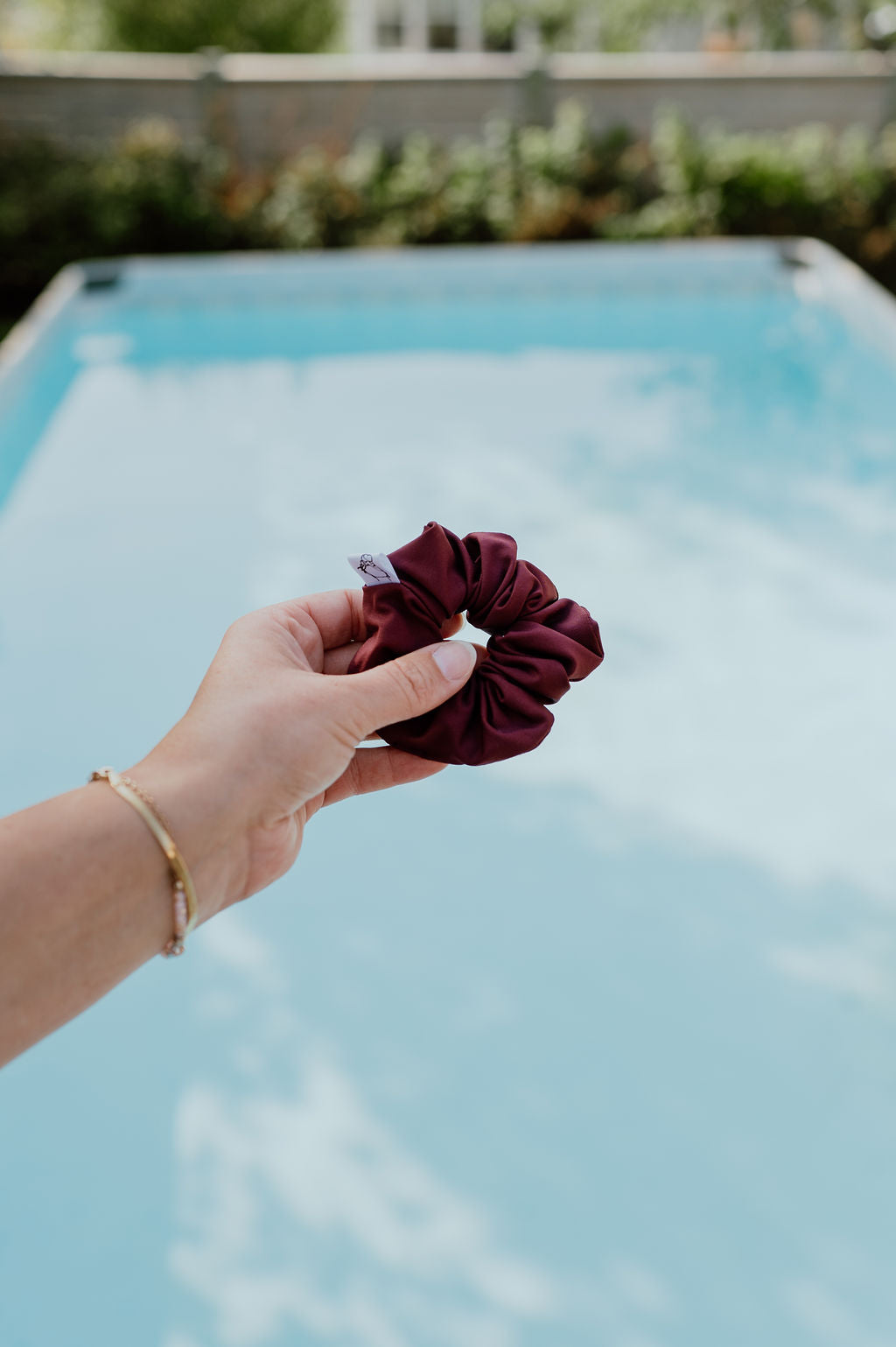 SWIM scrunchies in various colors for poolside and beach use.