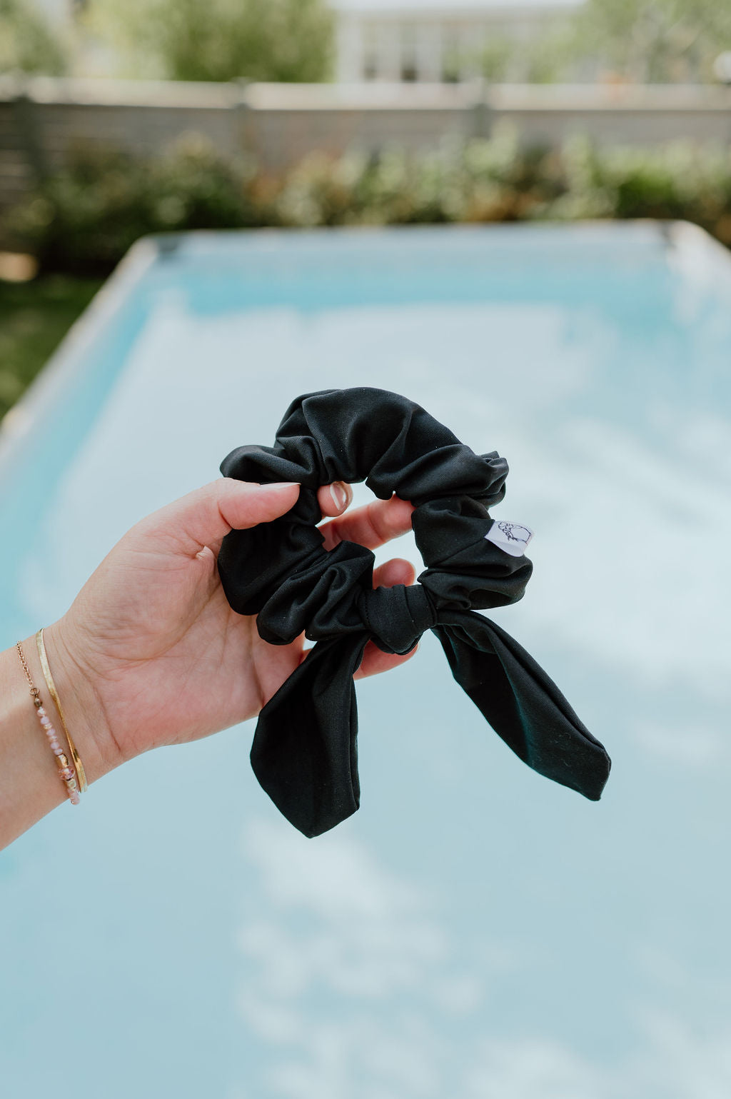 Quick-drying scrunchies in neutral tones for beach outings.