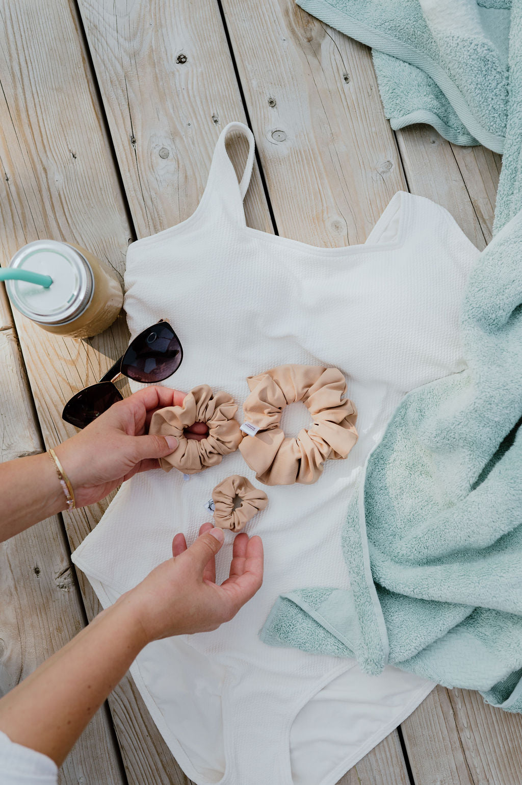 Classic tan swim scrunchie holding hair securely