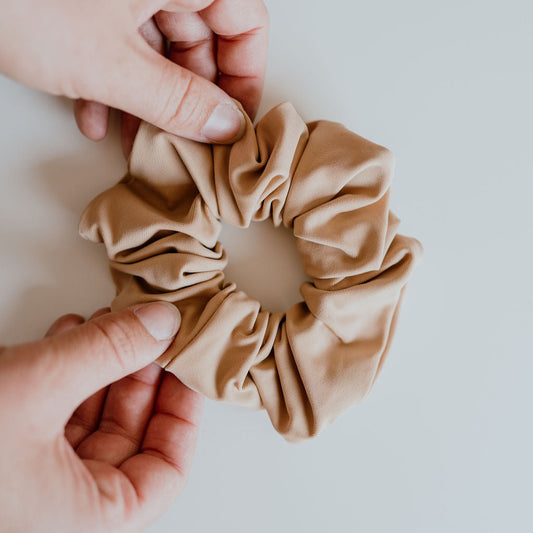 Tan swim scrunchie made from quick-dry fabric