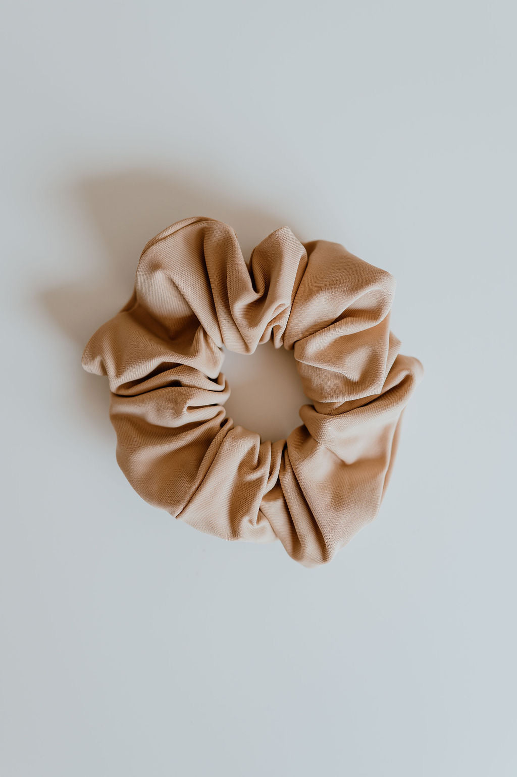 Neutral tan scrunchie drying fast after water exposure