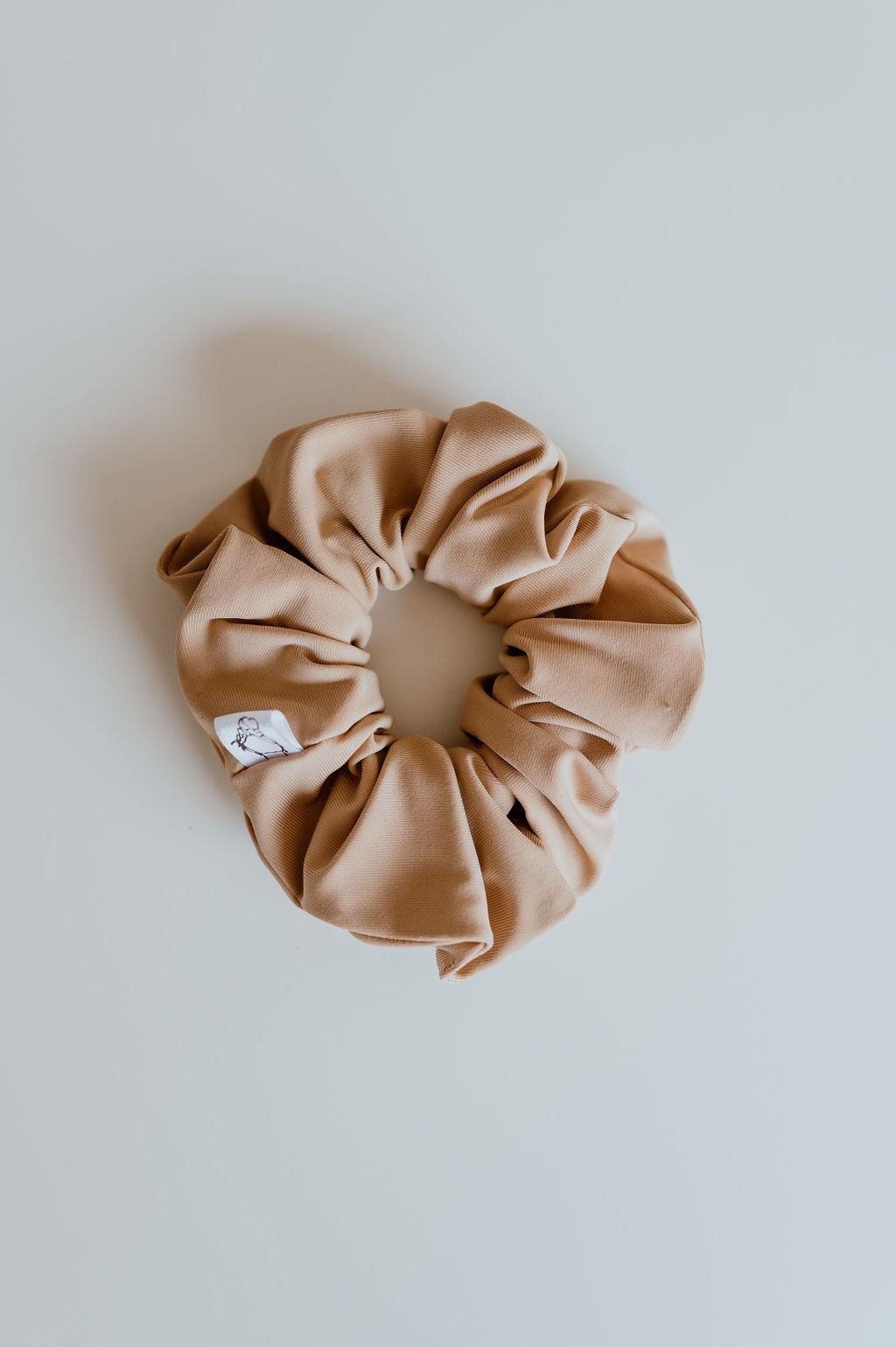 Water-resistant tan scrunchie for pool and outdoor use