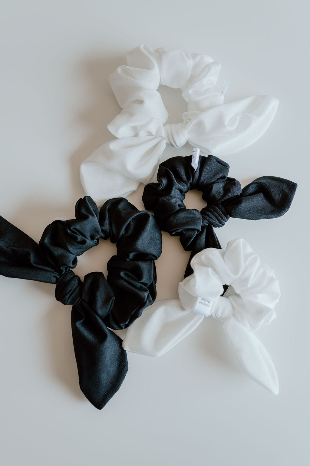 Stylish swim scrunchies in a variety of neutral colors and styles.