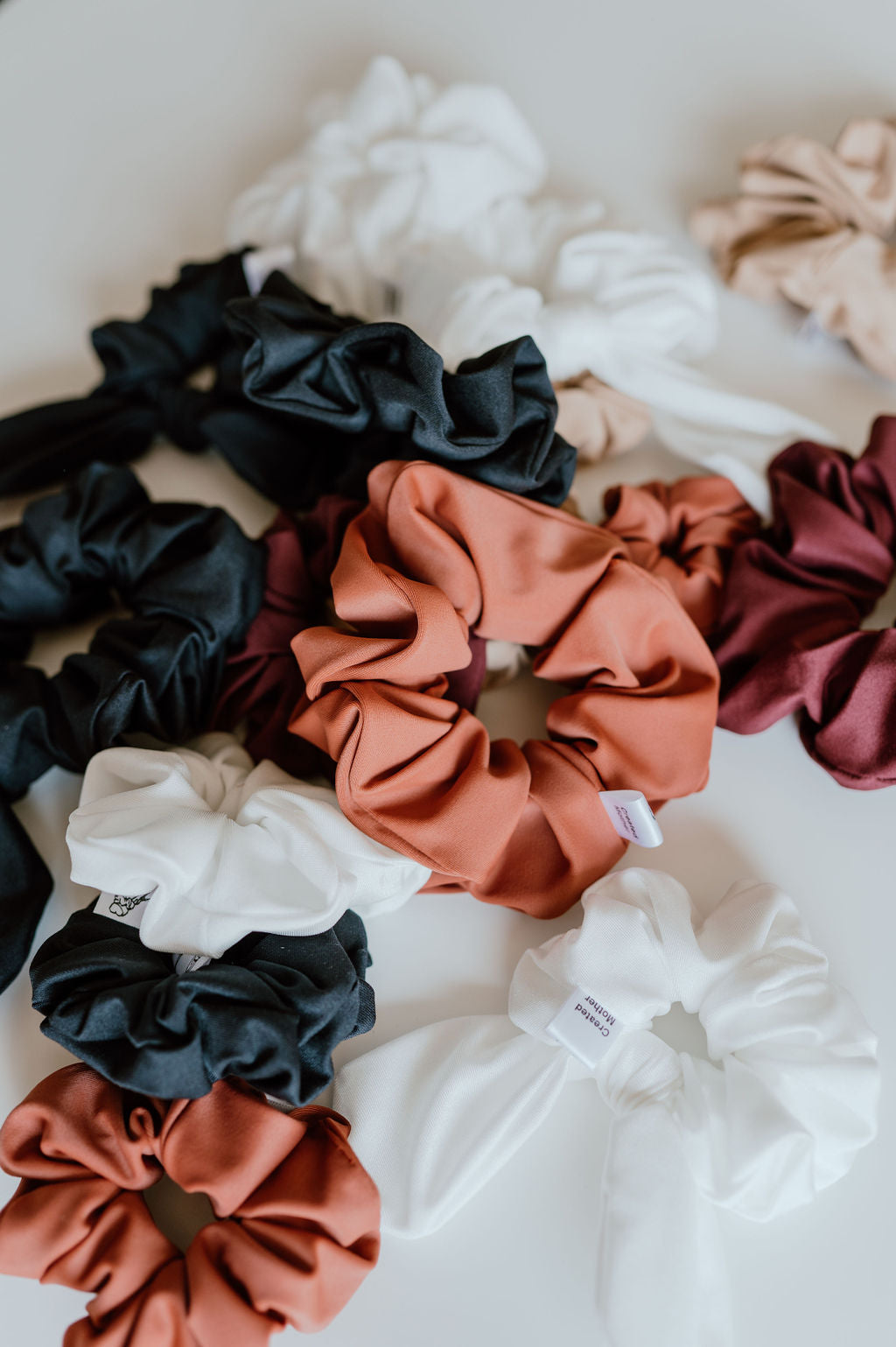 Quick-drying scrunchies in assorted beach-friendly colors.